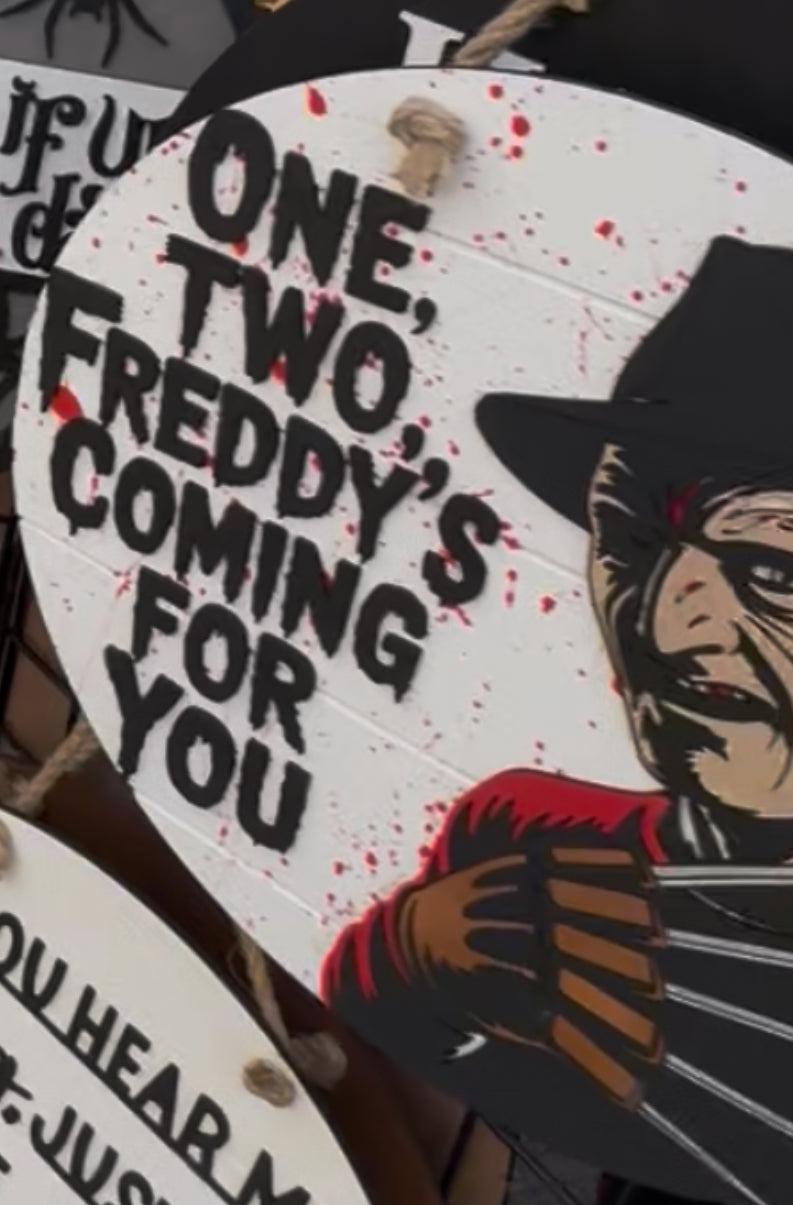 One two Freddy’s coming door hanger