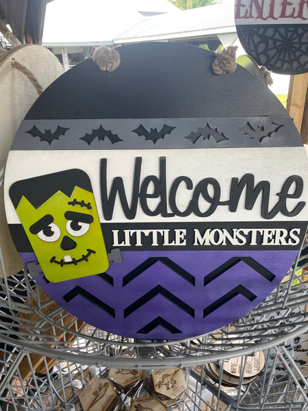 Welcome little monsters door hanger round
