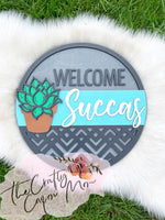 Welcome Succas round sign