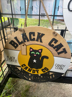Black cat candy co door hanger round